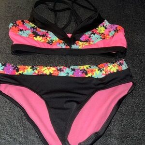 Justice 2 piece swimsuit. Black & pink floral print. VGUC. 12.
